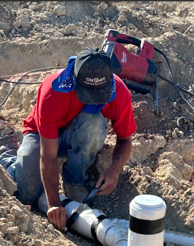 plumber working on water leak