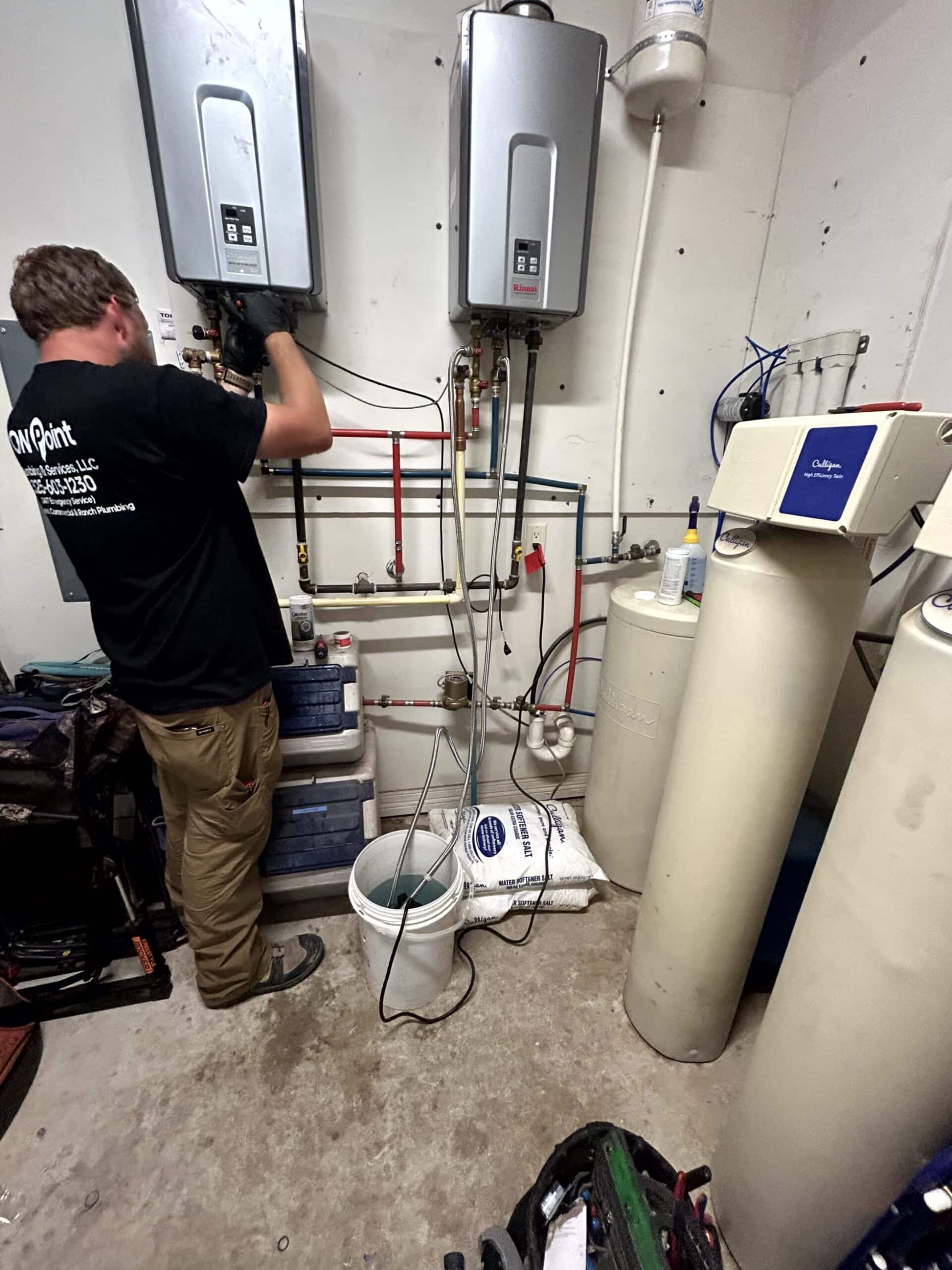 plumber working on pipes